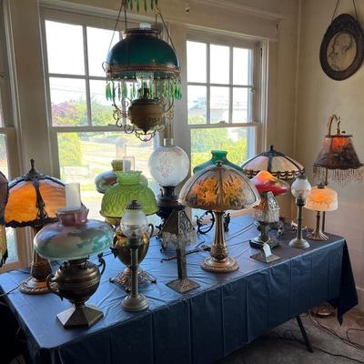 Dozens of antique lamps in Victorian, Asian, Art Deco, and Art Nouveau styles