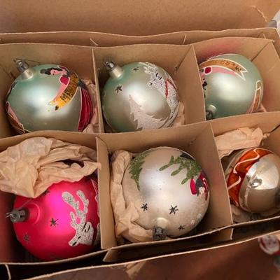Boxes of antique Christmas decor throughout the house