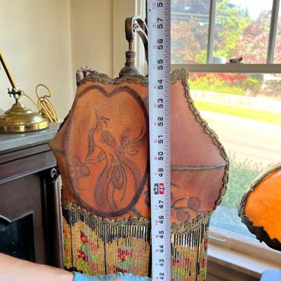 Several antique floor lamps with great shades and fringe 