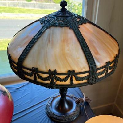 Tables of antique lamps - some stained glass, some reverse painted, some blown glass - something for everyone!