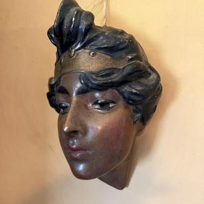 Antique decorated ceramic wall hanging mask of woman, potentially depicting a Moorish woman from the Orientalist period. 