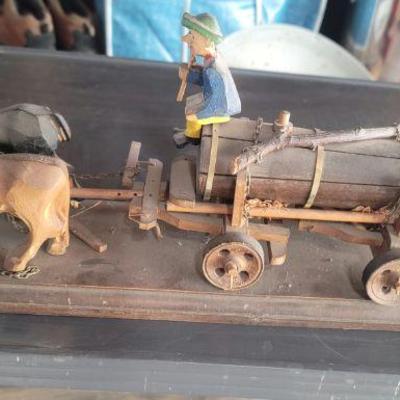 Hand carved beer wagon with driver and ox and mule
