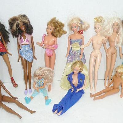 several lots of Barbie dolls