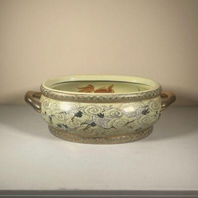 JAPANESE KOI FISH JARDINIÃˆRE | Large oval bowl depicting cranes, koi fish, flora & fauna with gilt handles and accented border. - l. 18...