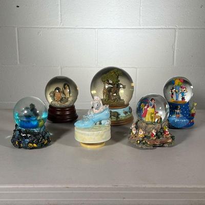 (6PC) SNOW GLOBES & MUSIC BOXES | Includes: Disney & Snow White snow globes, safari snow globe, penguin snow globe and 2 music boxes. -...
