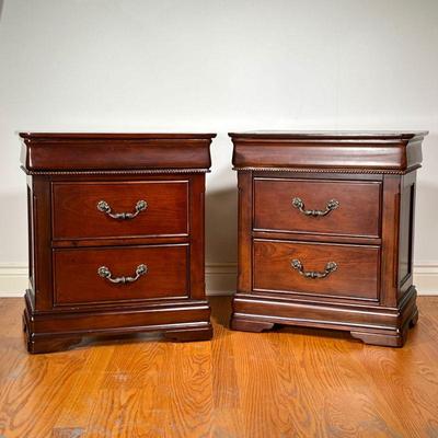 (2PC) PAIR MAHOGANY NIGHTSTANDS | Pair of wooden bedside tables, each with two drawers, by Davis International Furniture. - l. 26 x w. 18...