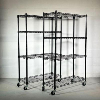 (2PC) BLACK METAL SHELVING UNITS | Black shelving units on wheels, each with 4 grated shelves. - l. 36 x w. 14 x h. 58 in