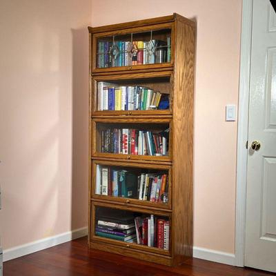 OAK BARRISTER BOOKCASE | Five shelves with sliding glass doors, top door with leaded glass. - l. 32.5 x w. 13 x h. 73 in