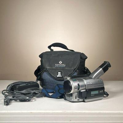 SONY DIGITAL HANDYCAM | Model No. DCR-TRV310. Includes camera, tape, extra battery, and power cable in camera bag.
