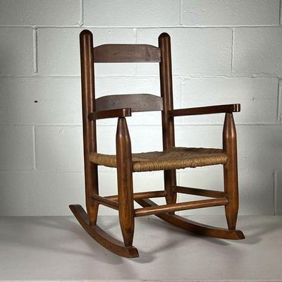 CHILDâ€™S ROCKING CHAIR | Small child's chair with rush seat. - l. 14.5 x w. 20 x h. 23 in

