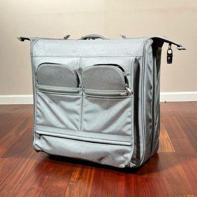LARGE TUMI GARMENT BAG | Large grey Tumi garment bag/travel suitcase, with multiple pockets and large folding center for garments, with...