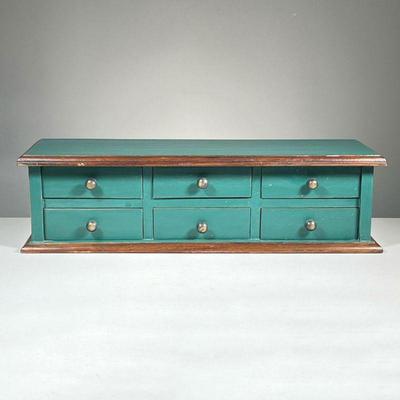 SMALL 6-DRAWER CABINET | Painted green with black handles, contains 6 small drawers with holes in the back to hang. - l. 8.25 x w. 24.75...