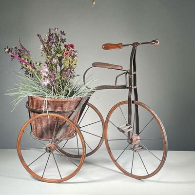 DISTRESSED TRICYCLE FLOWERPOT | Antique-looking tricycle with flowerpot in back currently holding fake flowers. Features carved wood seat...