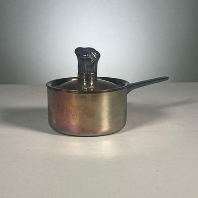 RAYNAUD CALUIRE SMALL POT | Very small white metal sauce pan, signed on the bottom with a figural handle. - l. 6.75 x dia. 3.25 in 