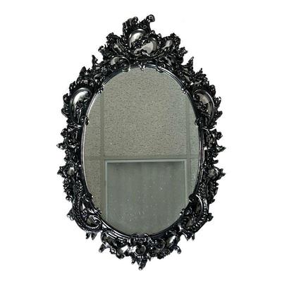 OVAL WALL MIRROR | Black oval wall mirror with wreath and floral border. - w. 19.25 x h. 29 in 