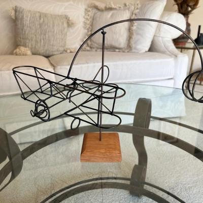 Vintage kinetic wire sculpture of an airplane