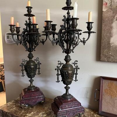 A pair of fabulous candelabra, metal with marble bases, Baroque style