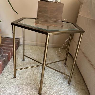 a pair of brass and glass faux bamboo end tables