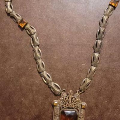 Amber stone and gold tone necklace