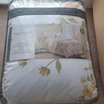 Three piece comforter set, new in the bag