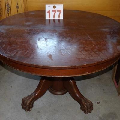 Turn of the century mahogany 50" claw foot dining table.