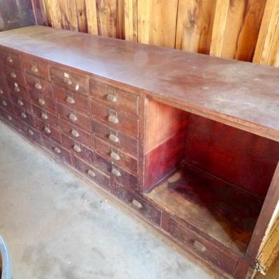 Spectacular country store dry goods show case. Multi drawer millinery show case.
