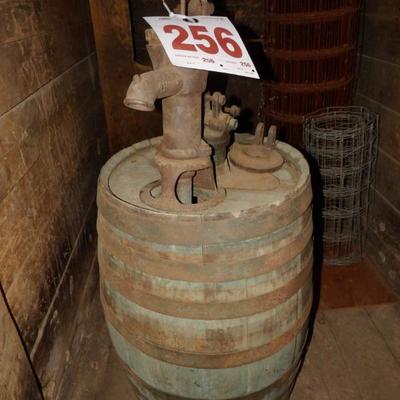 Myers pump and wooden barrel. Molasses barrel used for feeding livestock.