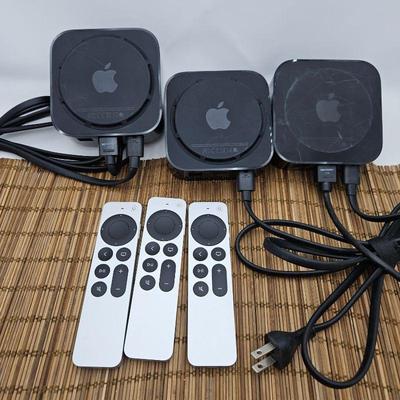 Three Apple TV Boxes with Newer Siri remotes