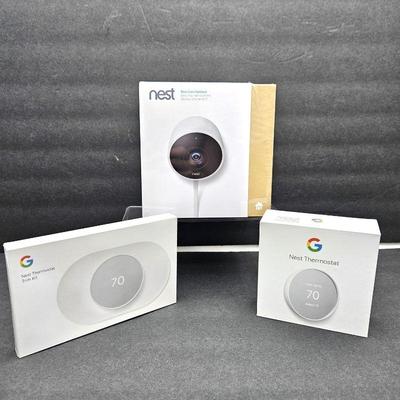 Nest Thermostat and trim kit, plus outdoor camera.  All new in box