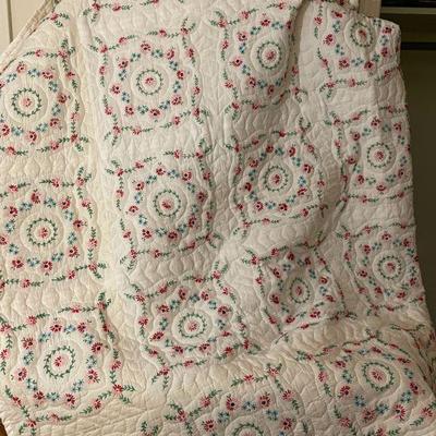 handmade quilt with flowering embroidering