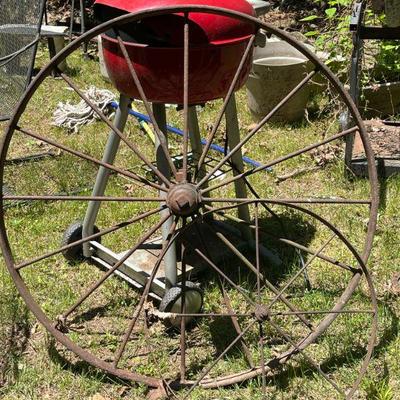 old iron wagon wheel and small  wheel