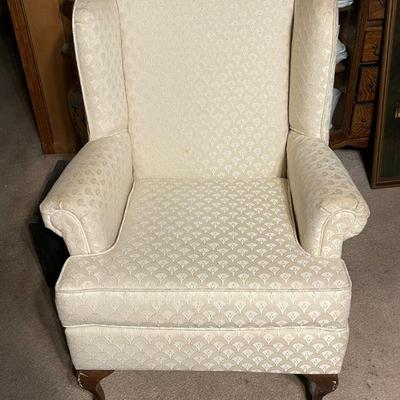 cream color wing back chair
