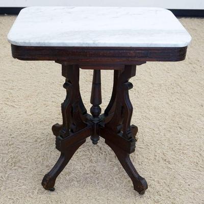 1183	WALNUT VICTORIAN MARBLE TOP PARLOR TABLE, APPROXIMATELY 27 IN X 19 IN X 30 IN HIGH
