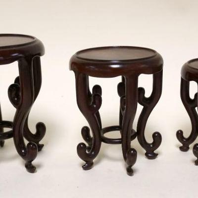 1100	LOT OF 3 GRADUATED ASIAN WOOD STANDS, TALLEST APPROXIMATELY 5 IN HIGH
