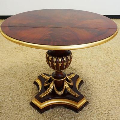1175	FLAMED MAHOGANY PEDESTAL TABLE W/GILT ACCENT CARVINGS & TRIM, APPROXIMATELY 40 IN X 31 IN HIGH

