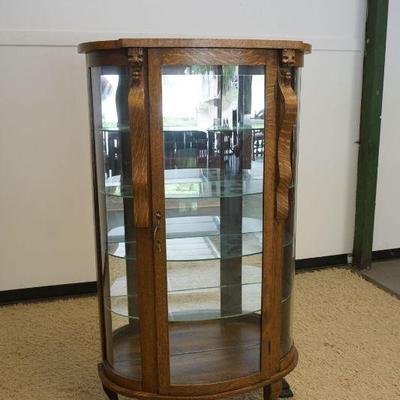 1247	ANTIQUE SHULL FURNITURE OAK CRYSTAL CABINET, MIRROR BACK, CLAW FOOT W/CARVED LIONS HEADS, APPROXIMATELY 38 IN X 15 IN X 66 IN HIGH
