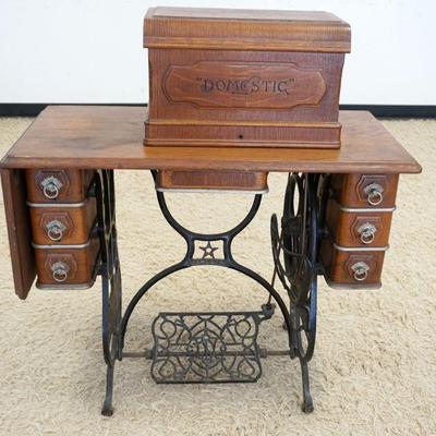 1187	ANTIQUE OAK DOMESTIC TREDLE SEWING MACHINE, APPROXIMATELY 35 IN X 17 IN X 39 IN HIGH
