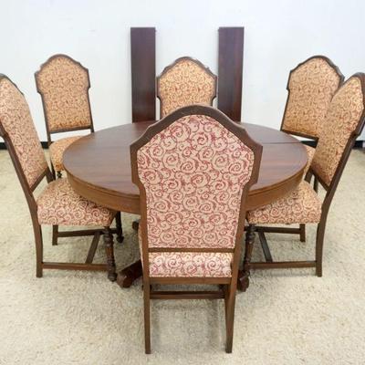 1163	ROUND MAHOGANY TABLE W/2 SKIRTED LEAVES & 6 UPHOLSTERED SIDE CHAIRS, TABLE APPROXIMATELY 54 IN
