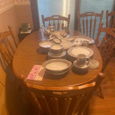 6 Place setting with a beautiful walnut table and chairs.  Looks new