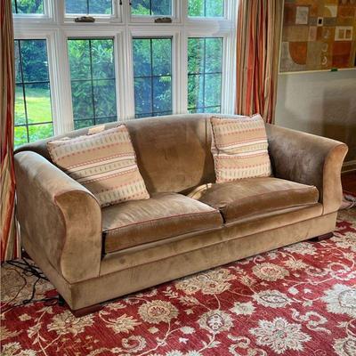 BROWN VELVET COUCH | Light brown velvet sleeper sofa with curved arms and red trim upholstery, accompanied by two down pillows (22 x 22...
