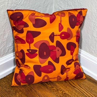 GUCCI THROW PILLOW | Gucci scarf throw pillow, having an abstract pattern on one side, and a plain red back. - l. 17 x w. 17 in 