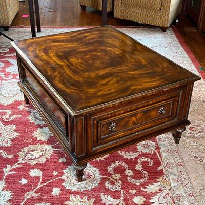 WOOD COFFEE TABLE | Dark wood coffee table with gold detailed edges, having a large drawer on two opposite side, with nicely figured...