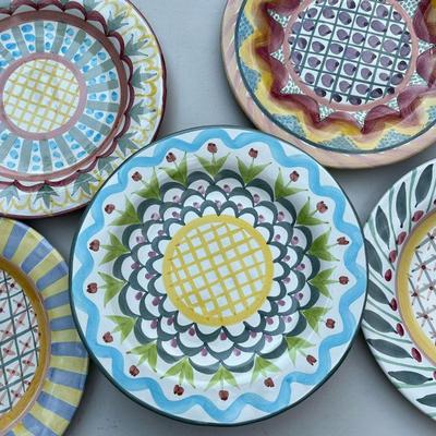 (14PC) MACKENZIE-CHILDS PLATES | Mackenzie-Childs plates with colorful designs, with patterns including Aalsmeer, Keukenhof, Brighton...