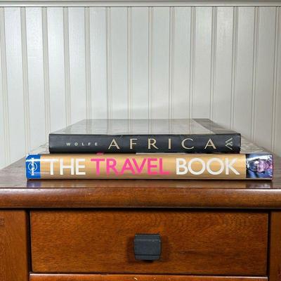 (2PC) [SIGNED] COFFEE TABLE BOOKS | Including Africa by Art Wolfe, signed by the author; and Lonely Planet The Travel Book, with...