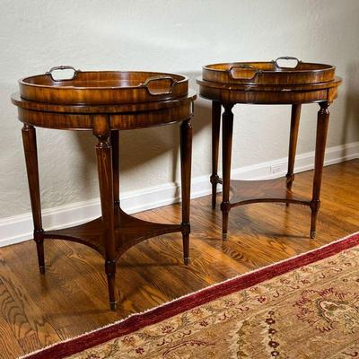 PAIR TRAY TOP SIDE TABLES | Round lift-top trays, the tables with inset leather tops of gilt tooled green leather, over a cross...