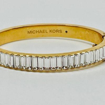 Lot 007-J: Michael Kors Cuff Bracelet

Features: Michael Kors Cubic-Zirconia gold-tone cuff bracelet with safety clasp

Dimensions: 8â€...