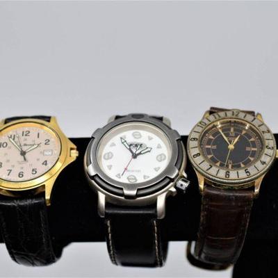 Lot 044-MM: Trio of Menâ€™s Quartz Wristwatches

Includes: 
â€¢	Fossil FL 4113, with black leather band (not a Fossil band)
â€¢	Fossil...