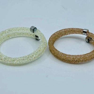 Lot 008-J: Encrusted Swarovski Crystal Bracelets

Features: Pink and white encrusted adjustable Swarovski crystal bracelets....