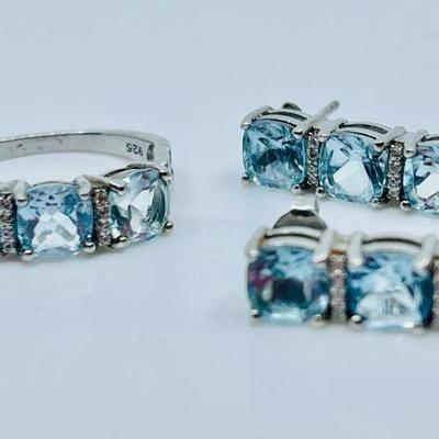 Lot 042-J: Sterling and Gemstone Ring and Earrings

Features: 
â€¢	Size 8.25 sterling ring settling with lab-created gemstones
â€¢...