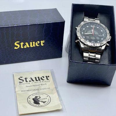 Lot 020-J: Stauer Compendium Hybrid Watch

Features: 
â€¢	Stainless-steel band
â€¢	Quartz
â€¢	Water-resistant
â€¢	Digital and analog
â€¢...